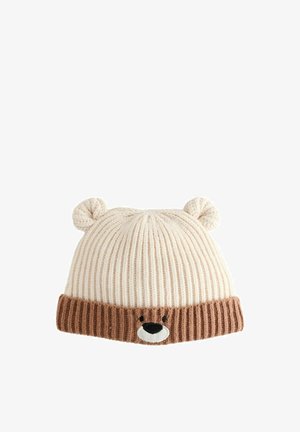Knitted hat in cream and light brown. Features ribbed texture, bear face design with white muzzle, and two rounded ear accents on top.