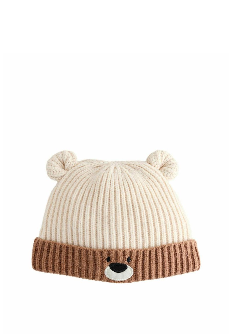 Knit hat in light cream and brown with ribbed texture. Features bear face design with ears on top and contrasting brown brim.