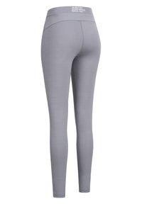 Leggings grigi realizzati in tessuto elasticizzato con una vita alta, texture liscia e dettagli di cucitura minimi. Logo stampato sul retro.