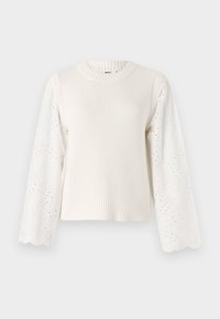 Maglione color crema con corpo a coste e maniche lisce ricamate che presentano ritagli floreali e polsini a ondina.