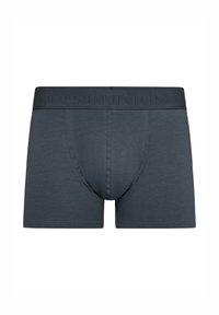 Bóxer en gris oscuro, con una cinturilla sin costuras y con marca en relieve, fabricados con tejido suave y un diseño ajustado al cuerpo.