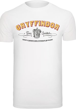 Tricou alb din bumbac cu text îndrăzneț în roșu și aur "Echipa Gryffindor Quidditch" și un design cu heraldica, însoțit de scrolluri decorative dedesubt.