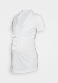 Top de maternidade branco feito de algodão macio. Apresenta mangas curtas, um decote em V profundo e um laço na cintura para um ajuste ajustável.