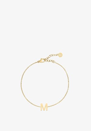 Armbanduhr aus vergoldeter Kette mit einem Anhänger in Form des Großbuchstabens "M". Zartes Gliederdesign mit Karabinerhaken und verstellbarer Länge.