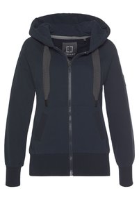 Felpa con zip color navy, dotata di cappuccio regolabile con cordoncino, due tasche frontali, polsini a costine e finitura testurizzata. Presenta il logo all'interno del colletto.