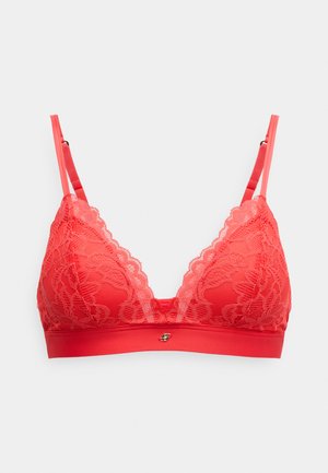 Εσώρουχο bralette από κόκκινη δαντέλα με τριγωνικό σχέδιο στα cups, κυματιστά τελειώματα και αδιαφανή ζώνη με διακοσμητικό μεταλλικό στοιχείο στο κέντρο.