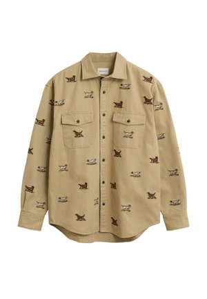 Khaki Hemd mit Knöpfen und zwei Brusttaschen, das mit gestickten Hundemotiven in verschiedenen Farben versehen ist. Aus Baumwollmaterial, lockere Passform.
