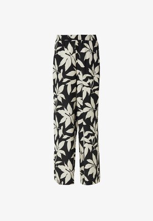 Schwarze weit geschnittene Hose mit großem weißem tropischem Blättermuster und elastischem Bund.