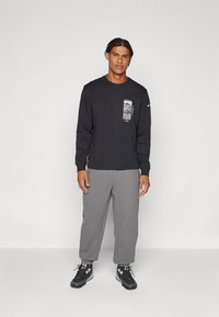 Adidas Terrex NATIONAL GEOGRAPHIC UNITEFIT GFX TEE LS - Tops ar garām piedurknēm - black