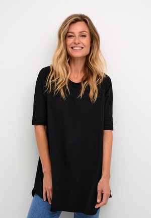 Black oversized t-shirt with short sleeves, round neckline, and a relaxed fit. Made from soft fabric, featuring a smooth texture and curved hem.