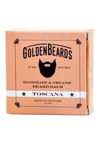 Skäggbalsamförpackning i orange med svart text, diamantaccenter och en skägggrafik. Etiketten säger "TOSCANA" och anger att den är handgjord och ekologisk.