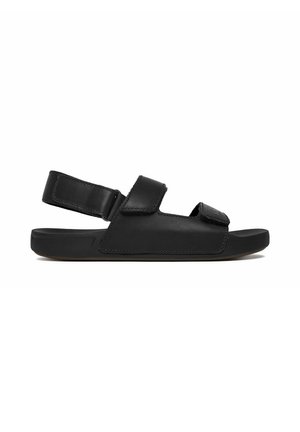 Sandalo nero open-toe con cinturini regolabili su dita e caviglia, suola piatta e design minimalista.