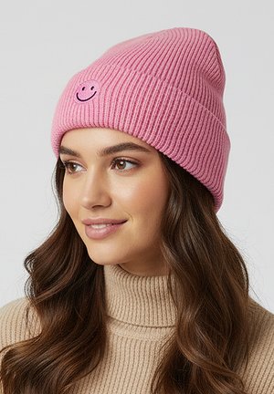 Pink ribbed knit beanie featuring a small embroidered smiley face, designed for a snug fit, showing texture and color contrast.