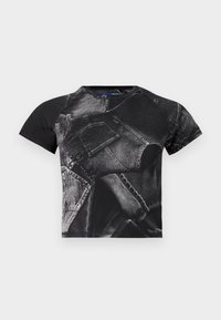 Black short-sleeve t-shirt featuring a large denim print with pockets and seams, made from cotton blend fabric with a textured finish.
