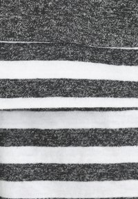 Gray and white striped fabric featuring alternating solid and heather textures, with visible stitching along the edges.