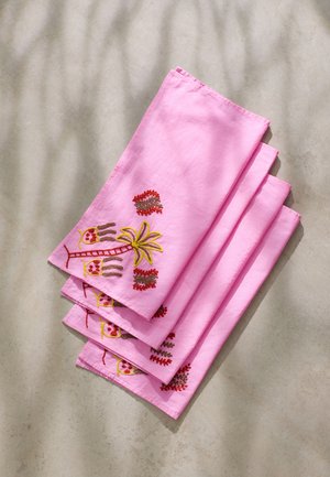Set of four pink cotton napkins featuring colorful embroidered designs of plants and flowers along one edge. Smooth texture, rectangular shape.