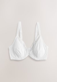 Soutien-gorge blanc à armatures avec bretelles réglables et bonnets en tissu doux, présenté à plat sur un fond beige clair.