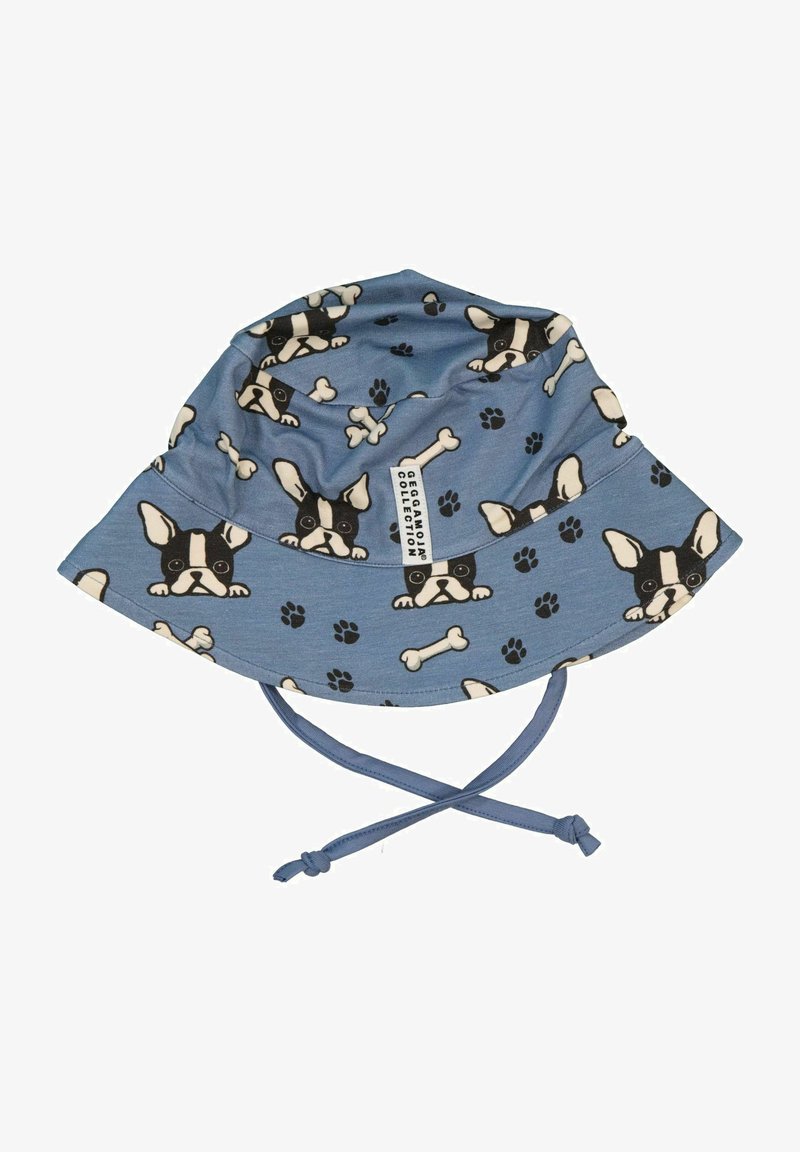 Sininen kangasbaskeri, jossa on mustavalkoista ranskalaista buldogia, luita ja tassunjälkiä esittävä kuvio; sisältää säädettävät hihnat.