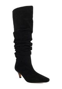 Black suede knee-high boot with a slouchy design, pointed toe, and a small heel. Textured surface and seamless construction.