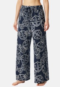 Marineblauwe wijde broek van lichtgewicht stof met een witte ster- en wereldbolprint. Elastische tailleband met een koorddetail.