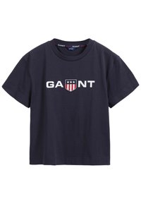 Tmavě modré bavlněné tričko, krátké rukávy, kulatý výstřih. Obsahuje bílé vyšívané logo "GANT" a design štítu se hvězdami a pruhy.