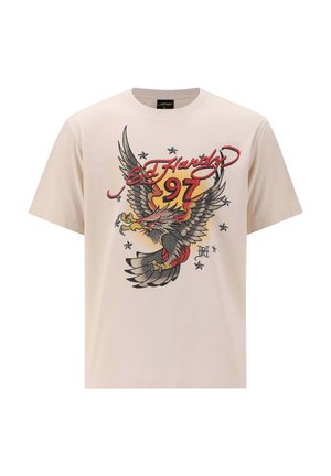 Beige cotton t-shirt featuring a large eagle graphic with red and yellow accents, "Ed Hardy" text, and stars in a textured print design.