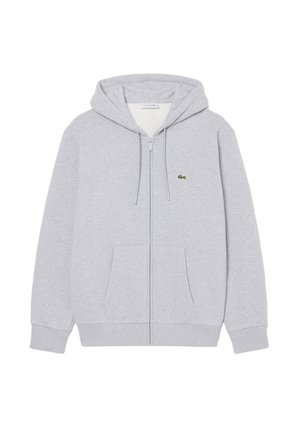 Sweat à capuche gris clair zippé avec poches avant, capuche réglable avec cordon et petit logo crocodile vert sur la poitrine.