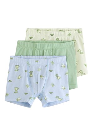 Tre børneboxershorts i lyseblå og creme med grønne frøtryk samt ensfarvet lysegrøn, arrangeret overlappende på en hvid baggrund.