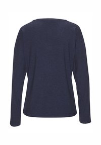 Navy blue long-sleeve ribbed top with a round neckline. Features a loose fit and soft texture, with a curved hemline at the bottom.
