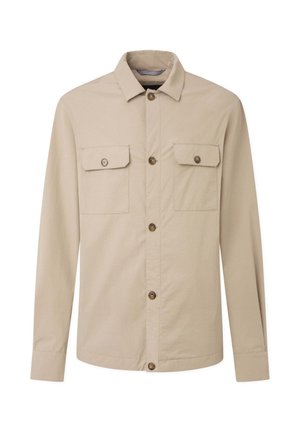 Jasnobeżowa, długosłaniowa koszula z kołnierzykiem zapinanym na guziki, z dwoma kieszeniami na piersi i brązowymi guzikami. Lekka tkanina o gładkiej fakturze.