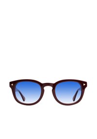 Gafas de sol de plástico marrón con lentes de degradado azul, forma de marco angular y acentos triangulares dorados en los bordes exteriores.