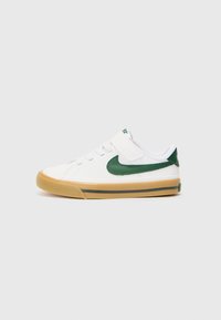 Vita sneakers med gröna detaljer, med �överdel i tyg, snörning och kardborreknäppning, gummisula och rundad tådesign.