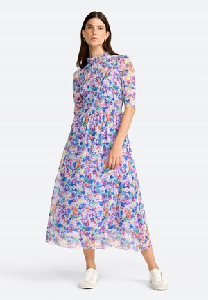 Abito maxiforma floreale in tessuto leggero e traslucido. Presenta un corpetto arricciato, maniche corte e un mix di fiori blu, rosa e arancioni.