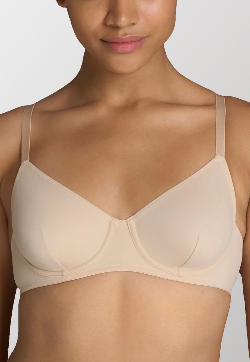 Reggiseno con ferretto beige in tessuto liscio e elasticizzato, dotato di spalline sottili e regolabili e coppe cucite per un miglioramento della forma.