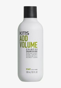KMS Add Volume Shampoo in einer weißen Plastikflasche mit schwarzem Deckel. Das Etikett zeigt grüne und schwarze Schrift, die die Volumen-Vorteile und die Inhaltsgröße beschreibt.