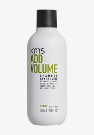 KMS Add Volume Shampoo in einer weißen Plastikflasche mit schwarzem Deckel. Das Etikett zeigt grüne und schwarze Schrift, die die Volumen-Vorteile und die Inhaltsgröße beschreibt.