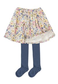 Falda de algodón con estampado floral en tonos pastel, con una cintura elástica, combinada con medias opacas en azul oscuro.