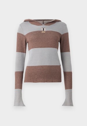 Kapišoninė megzta palaidinė su dryžiais, ruda ir šviesiai pilka. Turi ilgas rankoves ir auksinę emblema krūtinėje. Minkšta tekstūra.