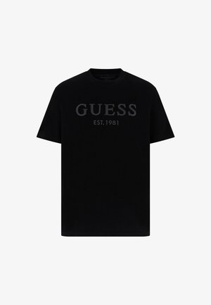 Czarna bawełniana koszulka z krótkim rękawem z napisem "GUESS" oraz "EST. 1981" w wytłoczonym wzorze. Klasyczny okrągły dekold oraz krótkie rękawy.