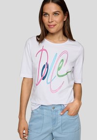 White short-sleeve t-shirt featuring colorful, stitched "Dole" text in pink, blue, and green. Smooth cotton material with a relaxed fit.