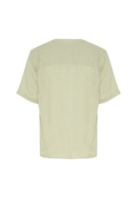 Camicia in lino verde chiaro a maniche corte con collo rotondo, vestibilità leggermente oversize e dettaglio cucitura sul retro superiore.