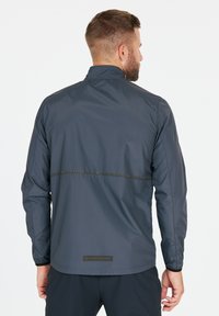Endurance HUGOEE - Löparjacka - ombre blue