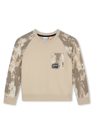 Sweat-shirt beige avec des manches texturées arborant un motif camo. Comprend une poche poitrine avec une étiquette de marque. Poignets et ourlet côtes.