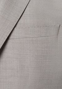 Light grey suit jacket fabric with a fine, textured weave. Features a single chest pocket and sharp lapel design.