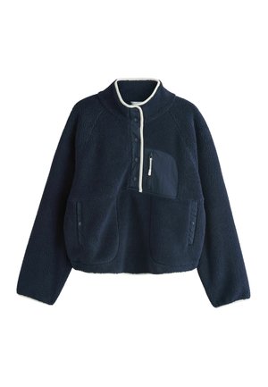 Marineblauer Fleece-Pullover mit weißem Besatz, Druckknöpfen vorne, Reißverschluss-Brusttasche und zwei Seitentaschen mit Druckknöpfen.