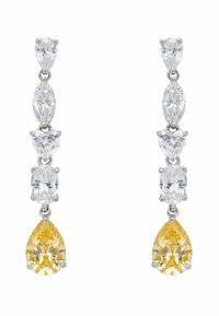 Lógó fülbevalók öt fazettált kővel: négy átlátszó drágakő különböző formákban és egy nagy sárga csepp formájú drágakő az alján.