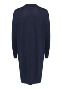 Abito lungo a maniche lunghe blu navy, con una vestibilità ampia e polsini a coste. Realizzato in un tessuto morbido e testurizzato con sottili luccichii.