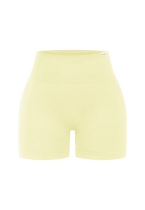 Shorts actifs jaune clair en tissu lisse et extensible. Dotés d'une taille haute élastique et d'un design près du corps.