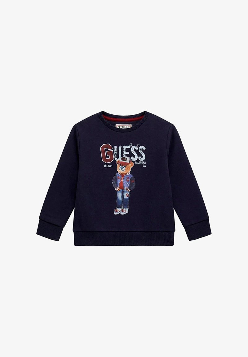 Felpa blu navy in cotone con scollo rotondo, dotata di una grafica di un orso in giacca e del logo "GUESS" stampato in evidenza.