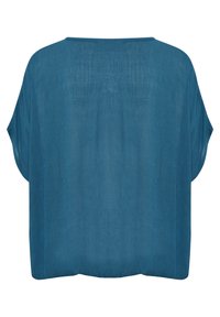 Top teal a vestibilità ampia con scollatura rotonda e maniche larghe. Tessuto morbido e leggero con una sottile texture. Design della parte posteriore semplice.
